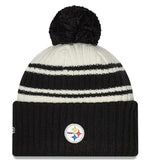 Men's New Era Cream/Black Pittsburgh Steelers 2022 Sideline Sport Cuffed Pom Knit Hat