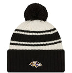 New Era Cream/Black Baltimore Ravens 2022 Sideline Sport Cuffed Pom Knit Hat